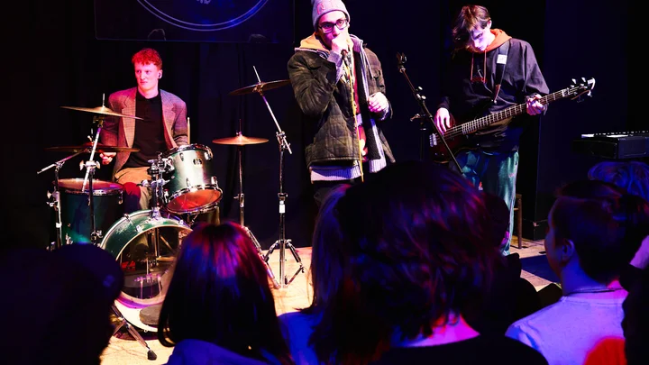 Students on stage performing at Band on the Wall in Manchester