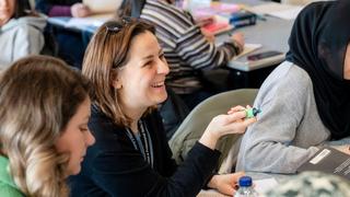 Adult learners taking part in a classroom discussion during an adult education course at The Manchester College.