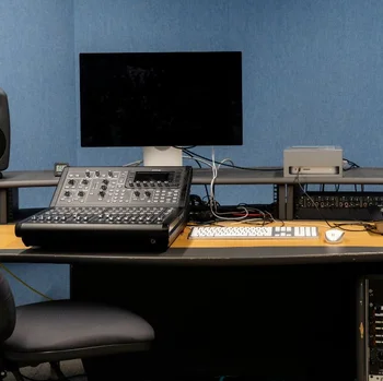 Music production workstation at The Manchester College City Campus Manchester, equipped with a digital mixing console, studio monitors and recording technology.