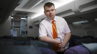Student engaging in practical learning in a Travel and Tourism course