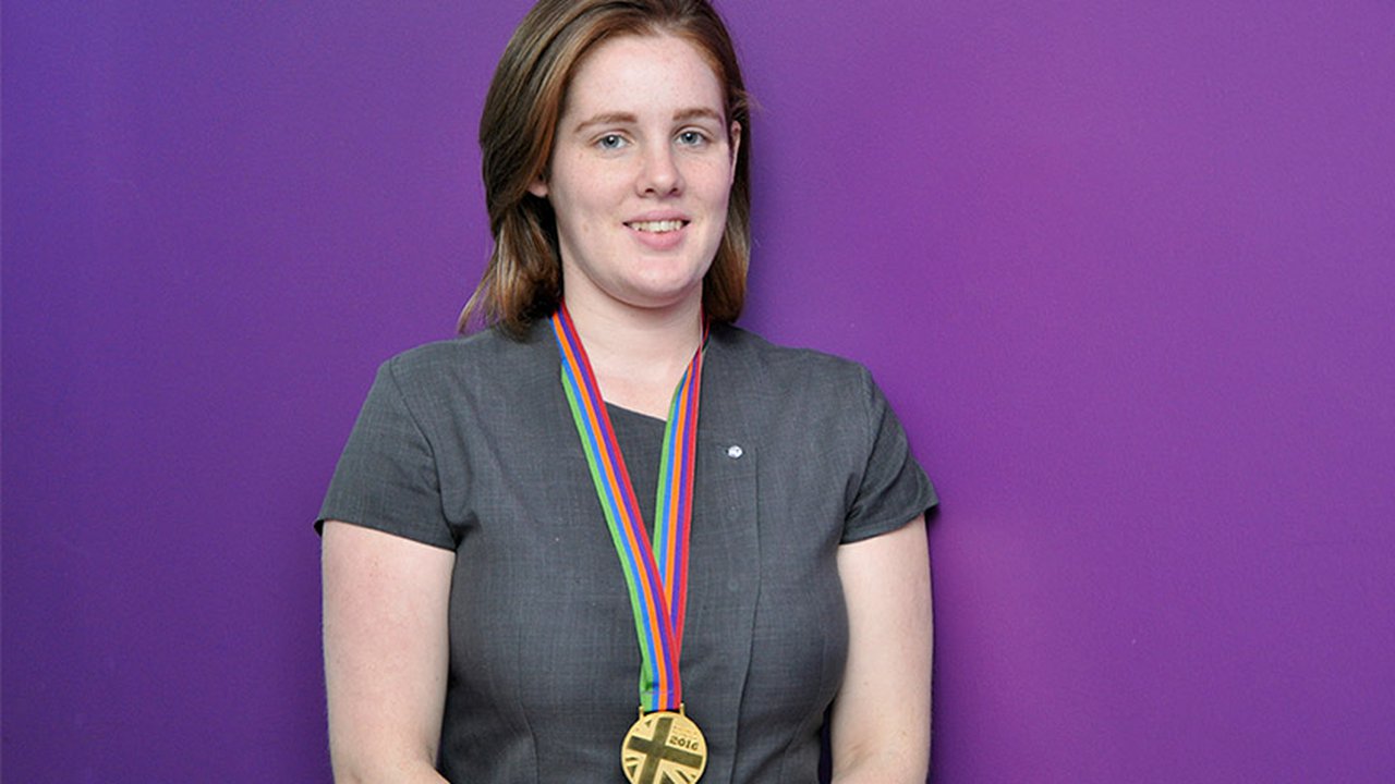 Portrait image of Kirsty Hughes with her medal