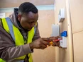 Student electrician wiring in a socket