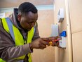 Student electrician wiring in a socket