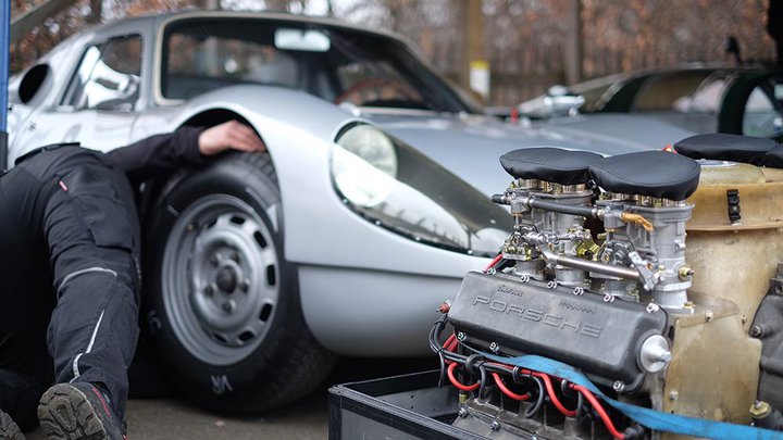 A mechanic working on a car