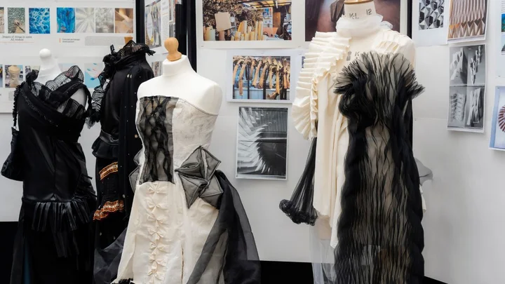 Fashion and Textiles student garments displayed on mannequins during a Visual Arts exhibition at The Manchester College.