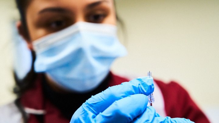 Girl preparing a needle