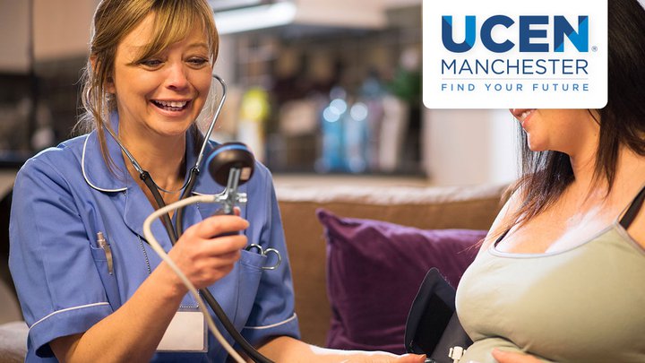 A nurse listening to a pregnant woman's stomach with a stethoscope