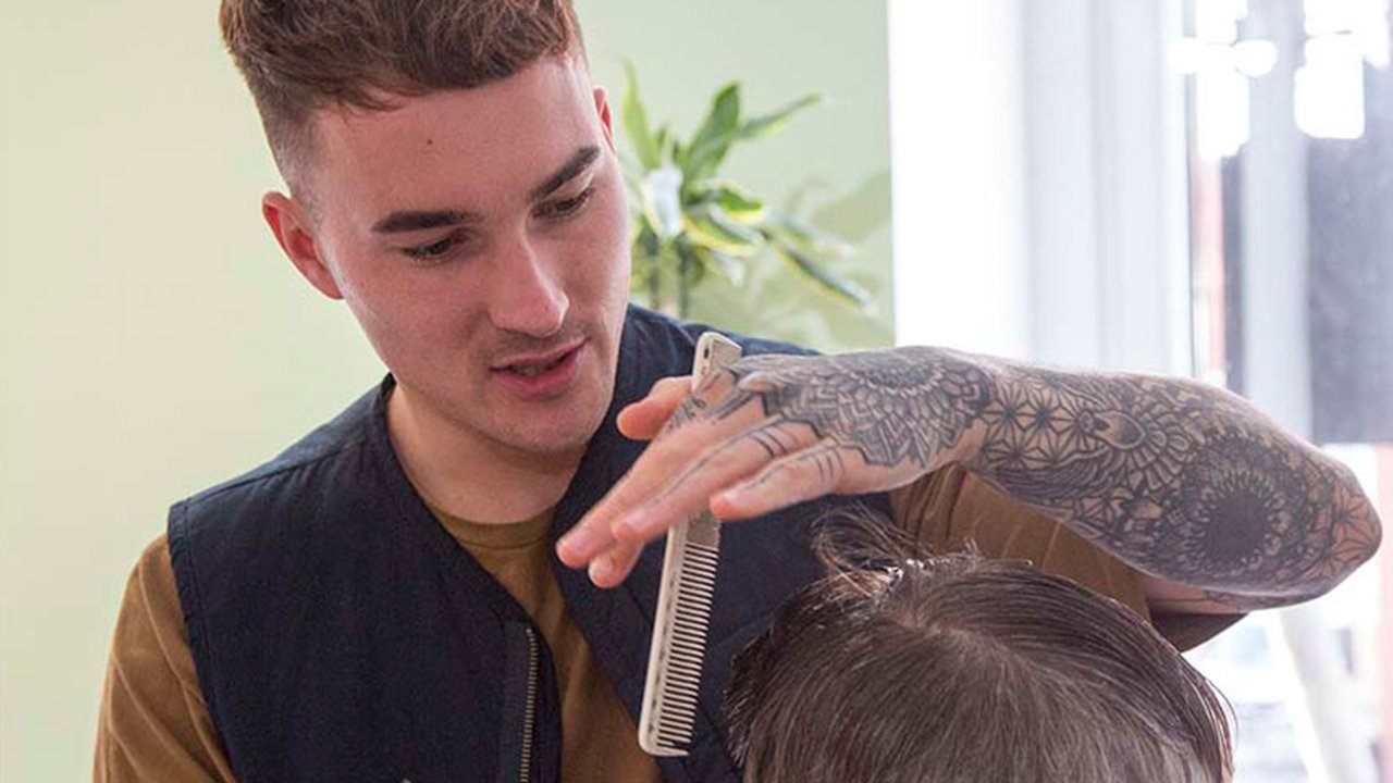 Tom Burbidge cutting hair