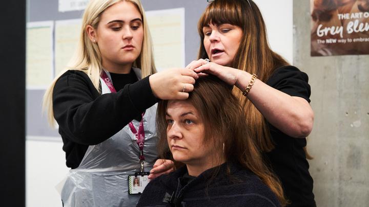 Hairdressing student with a client