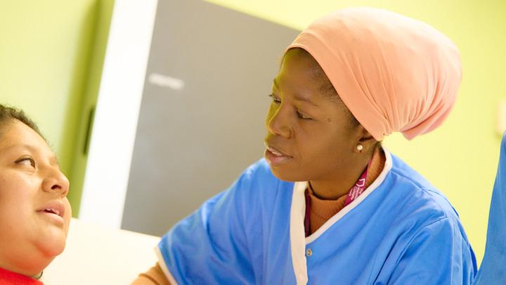 Female health student checking a patient