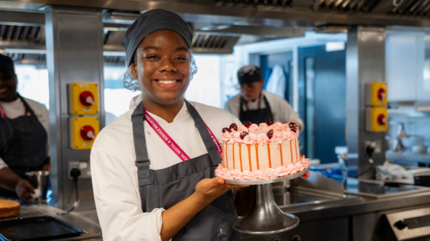 Catering student poses