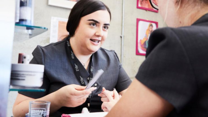 Students learning manicures