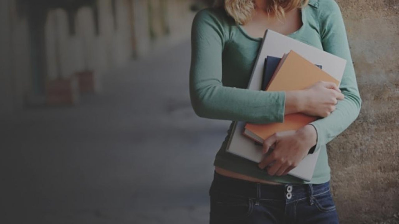 A woman holding books