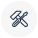 Black outline icon of crossed tools on a white background.