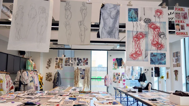Visual Arts studio displaying student sketchbooks, life drawings, fashion design work and creative portfolios at The Manchester College City Campus Manchester.
