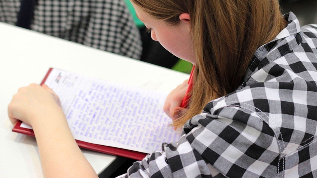 Woman Writing on Paper