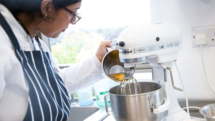 Catering student preparing food