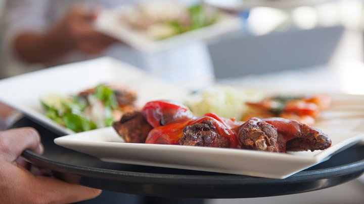 Close-up of a plate of food being served