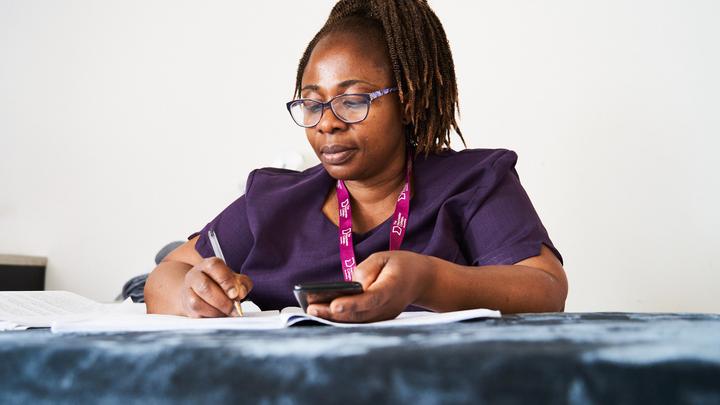 An adult hair and beauty learner studying
