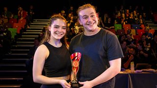 Photograph of two The Manchester College students collecting first prize in a Greater Manchester Colleges Skills Competition.