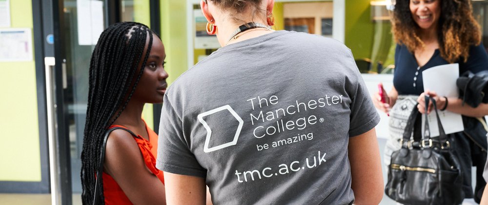 Prospective students and staff talking at an open event