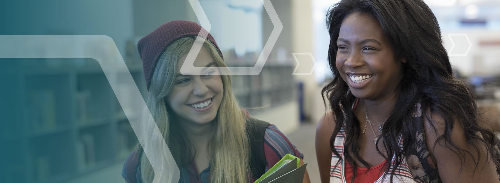 Two students smiling