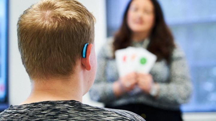 Deaf student in a classroom with teacher
