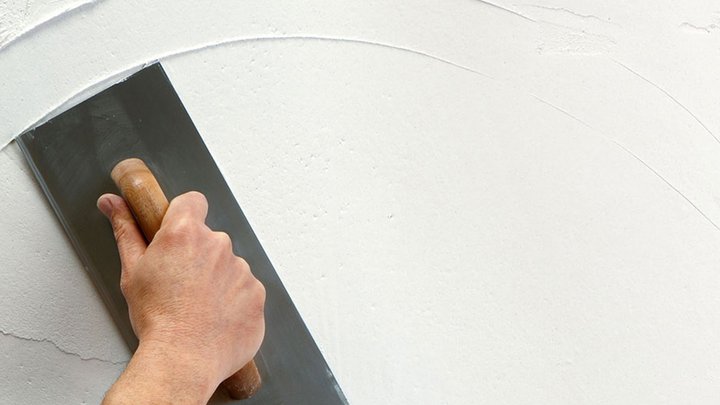 Close-up of  wall being plastered