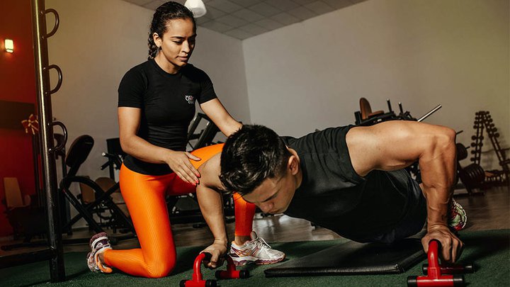 A personal trainer giving advice and motivation to a client